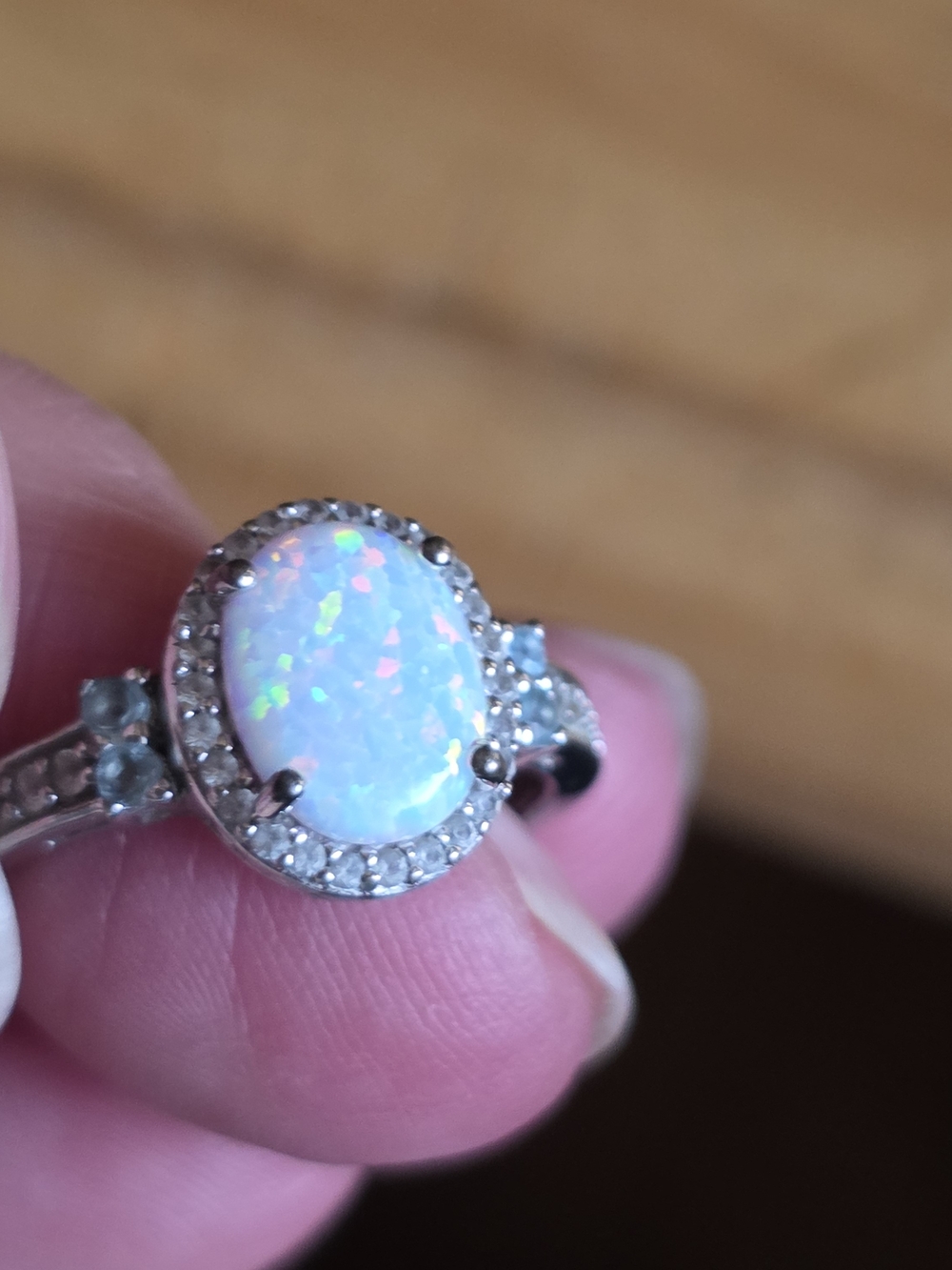 Oval White Opal Halo Ring with Silver-Tone Band